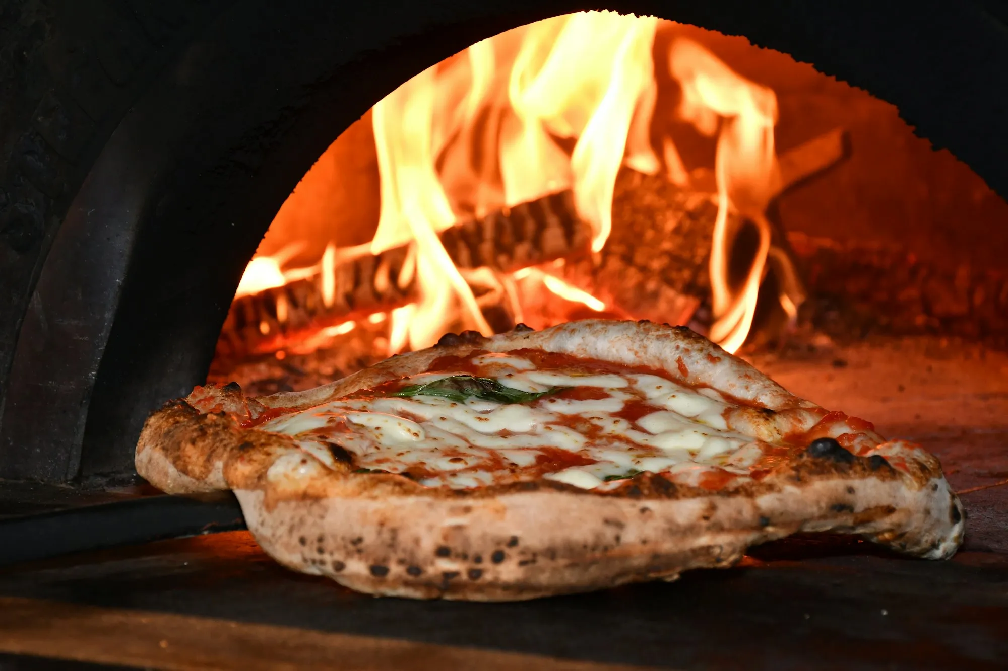 Pizza in a wood-fired oven