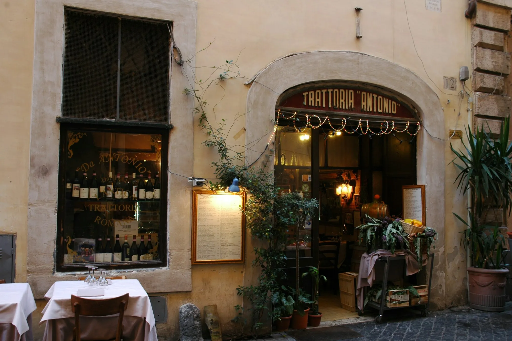 Old trattoria entrance on a Roman street